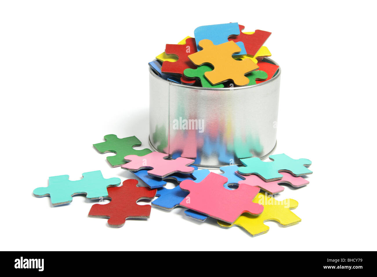 Jigsaw Puzzle Pieces in Tin Stock Photo