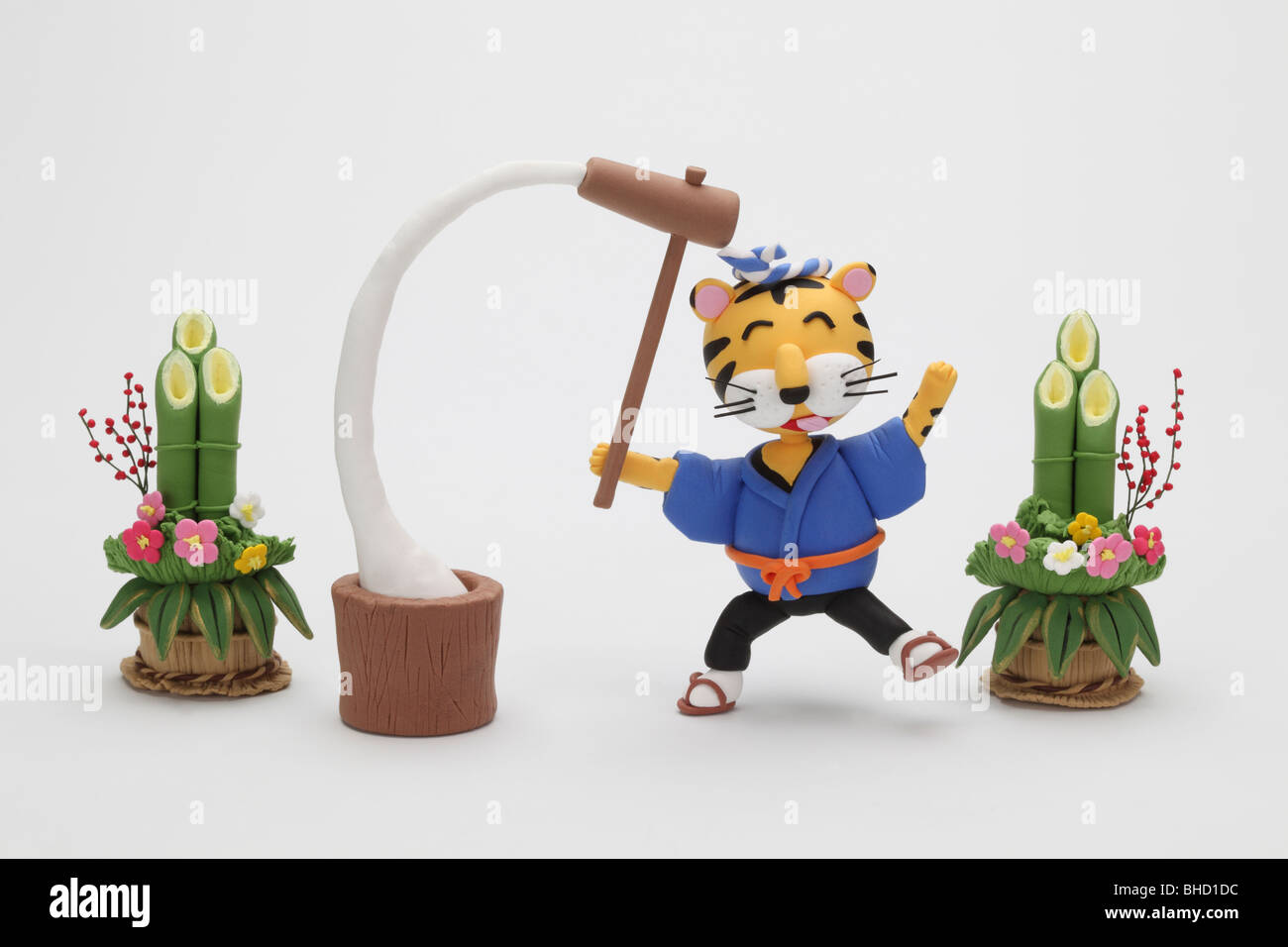 Tiger figurine pounding rice next to kadomatsu Stock Photo