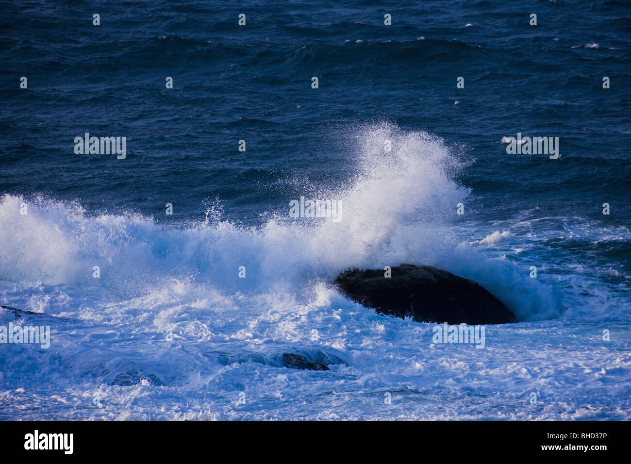 Waves crashing on rocks Stock Photo