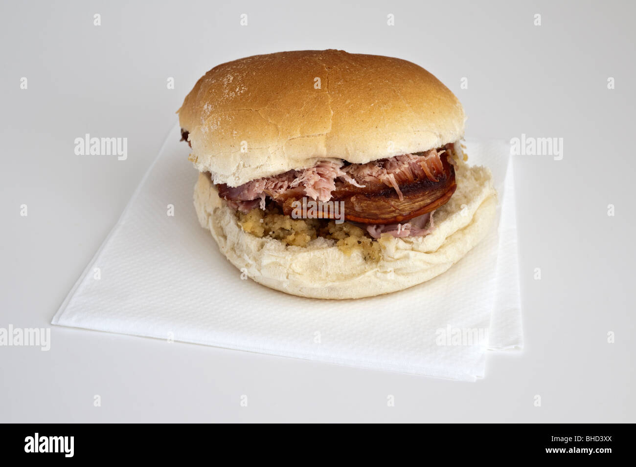 Roast pork sandwich on a white bread cake with apple sauce and crackling Stock Photo