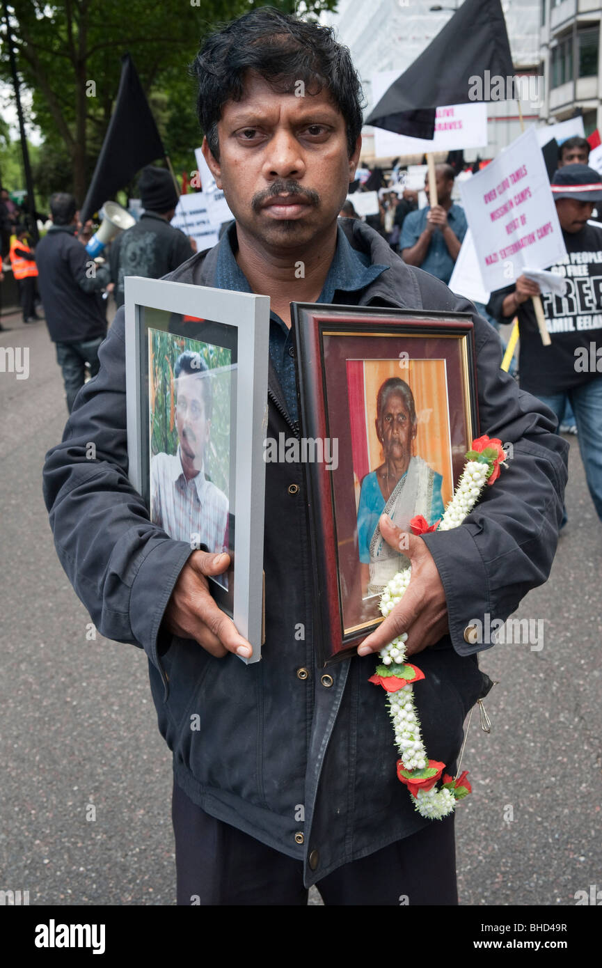 'March for Imprisoned Tamils' London 20 June 2009. Man with photographs of missing or killed Tamils Stock Photo