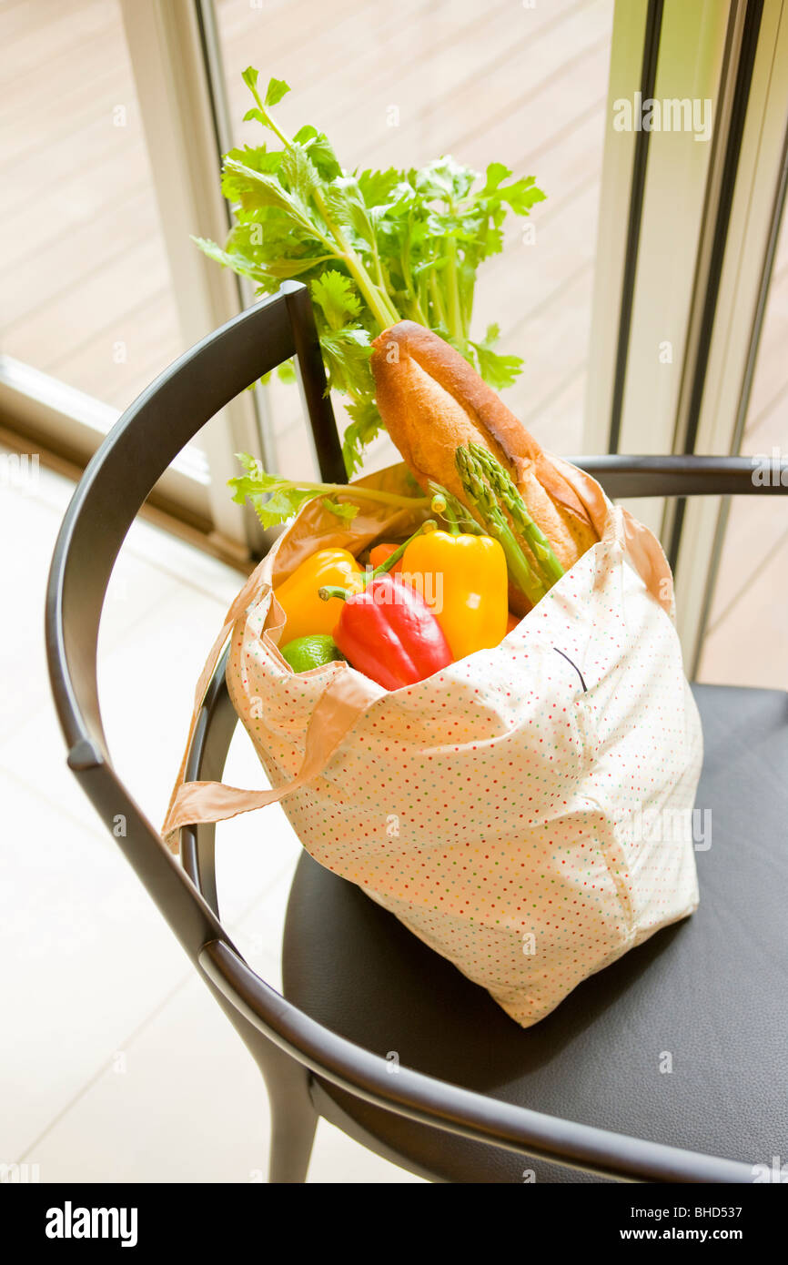 Grocery shopping on chair Stock Photo Alamy