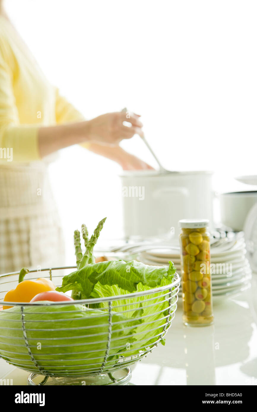 Woman cooking in kitchen Stock Photo - Alamy