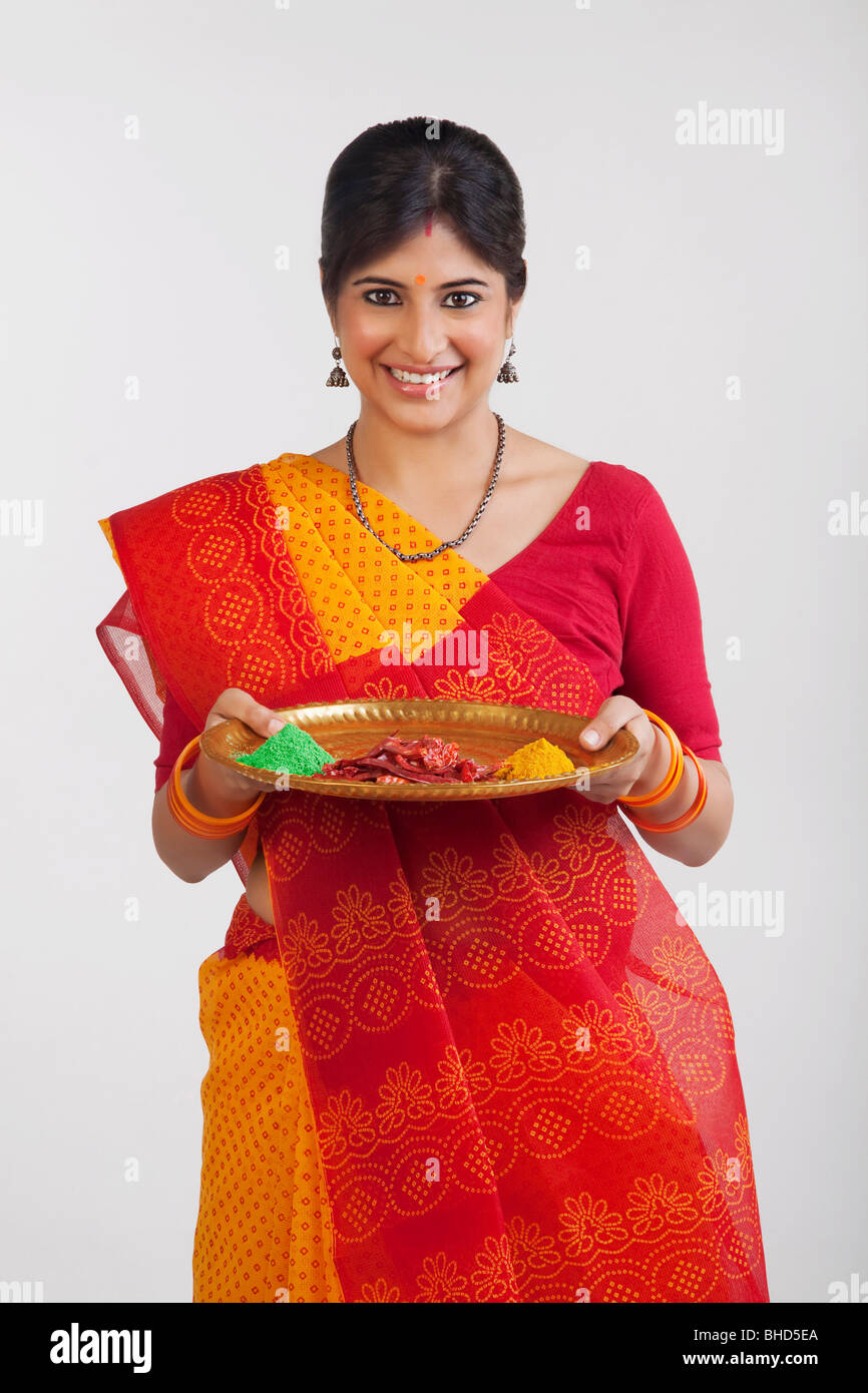 A Rajasthani woman holding a tray Stock Photo