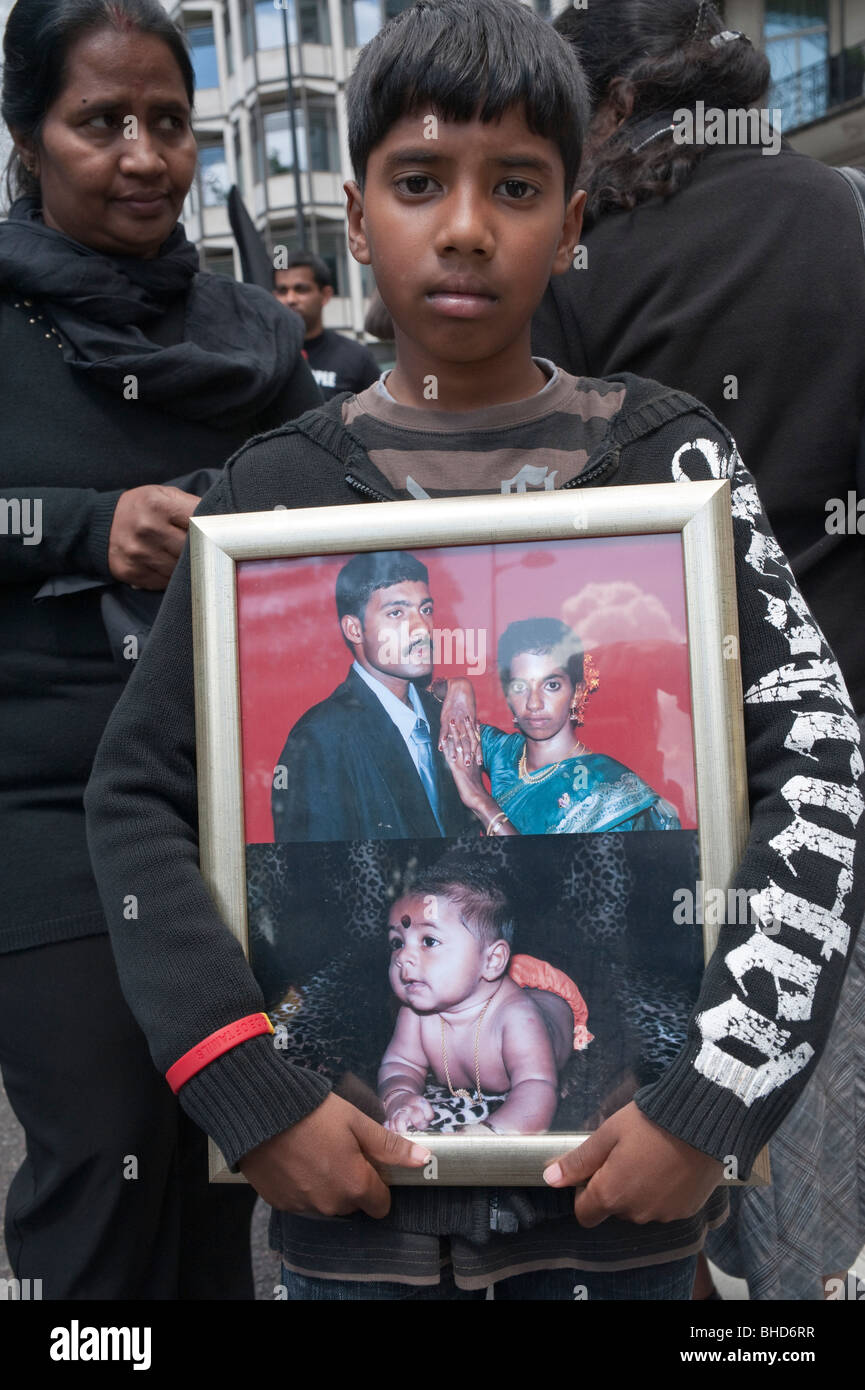 'March for Imprisoned Tamils' London 20 June 2009. Boy with photographs of missing Tamils Stock Photo