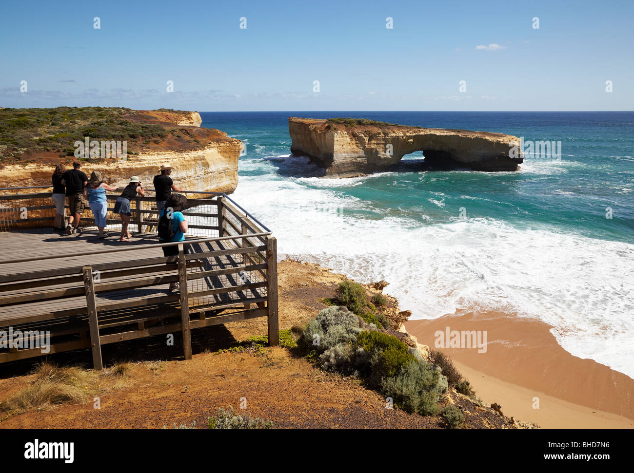 Tourists at one of the viewing platforms, London Bridge, Port Campbell National Park, Great Ocean Road, Victoria, Australia Stock Photo