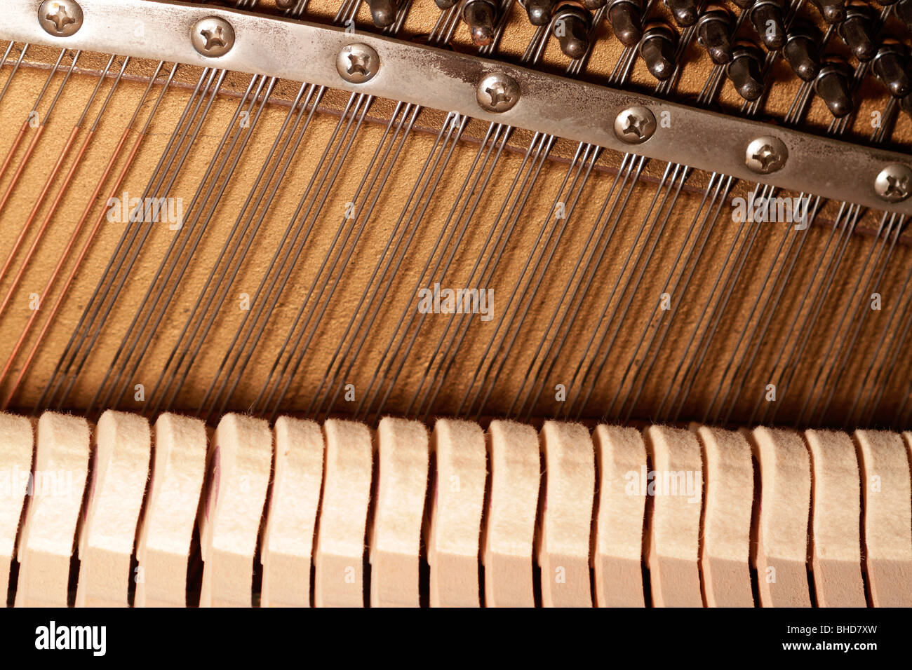 Piano harp and felt hammers Stock Photo