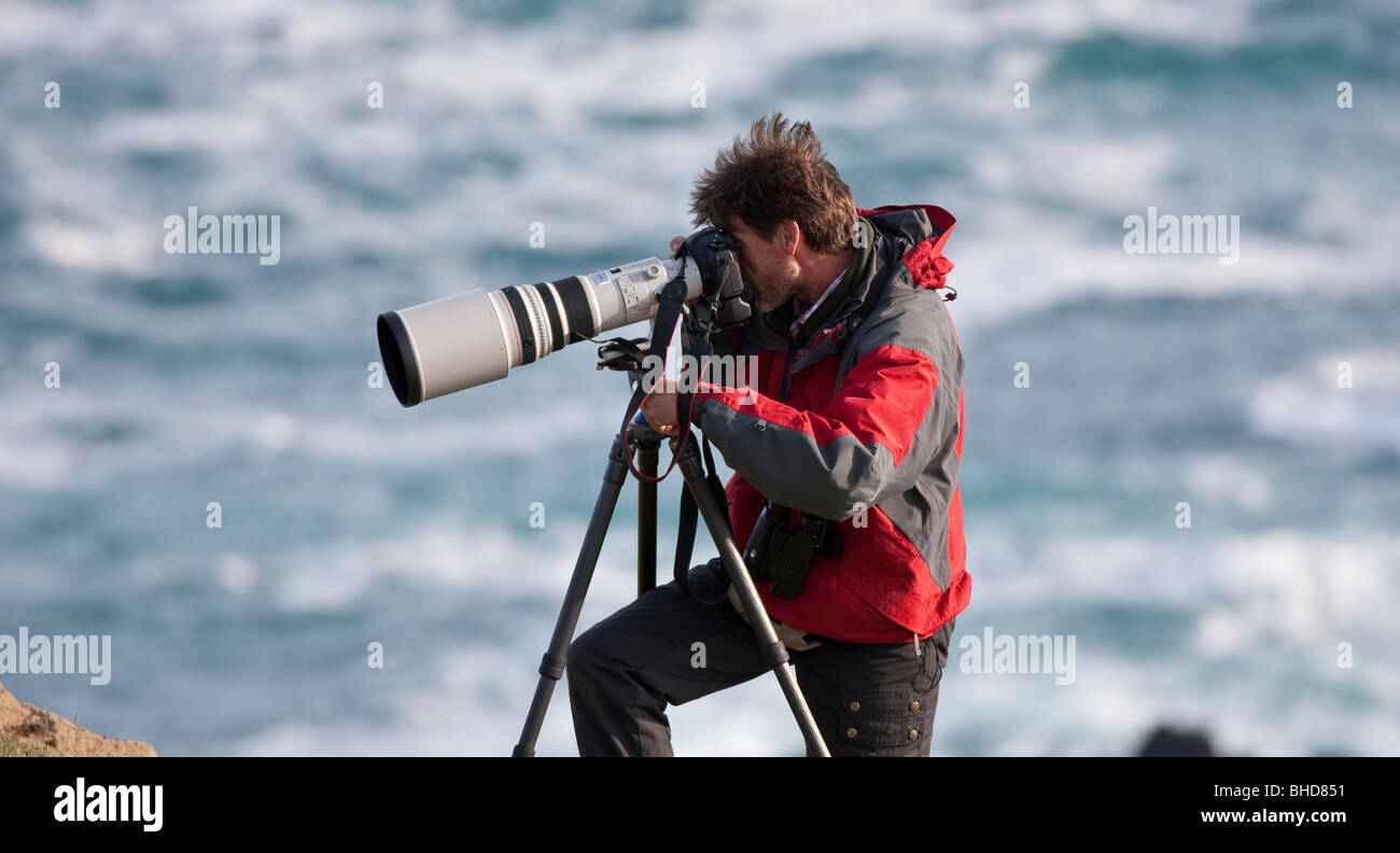 Photographer with telephoto lens, Snaefellsnes Peninsula, Iceland Stock Photo