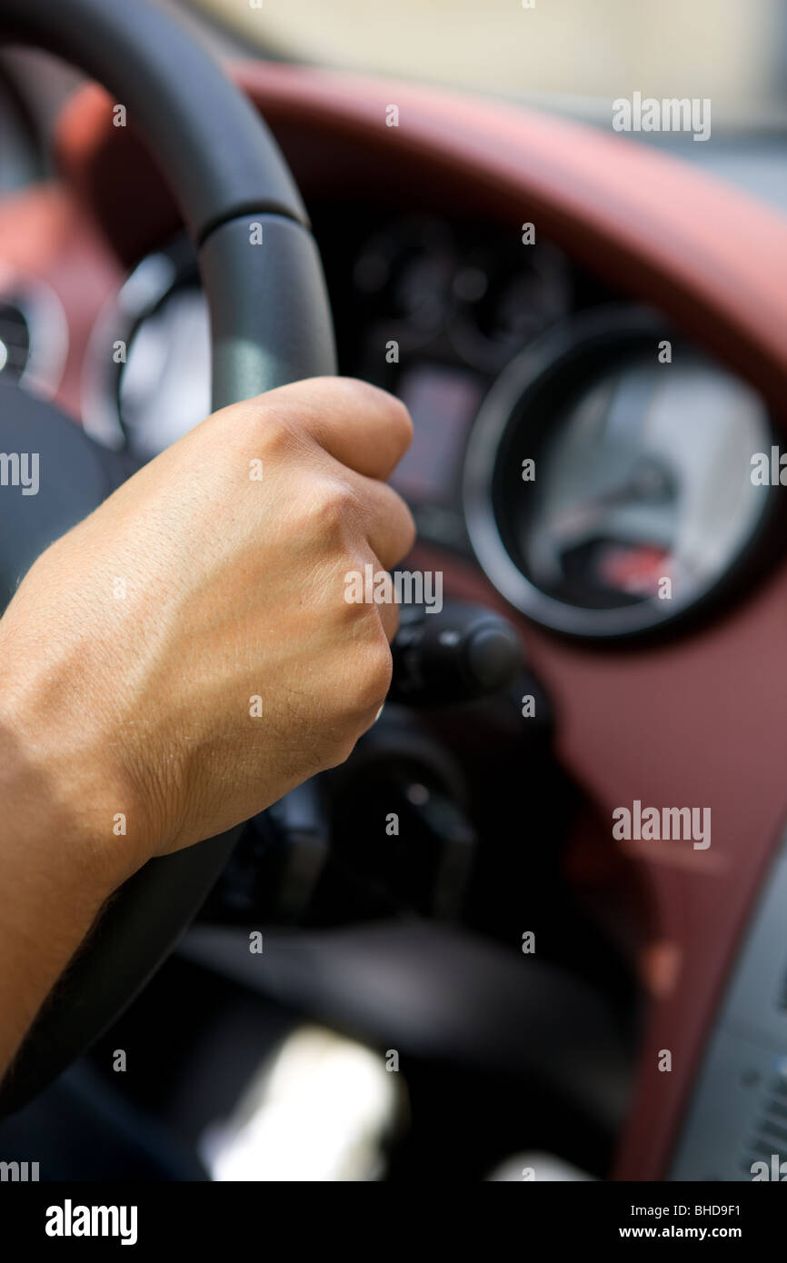 man at the wheel, steering wheel, hand-drive car Stock Photo