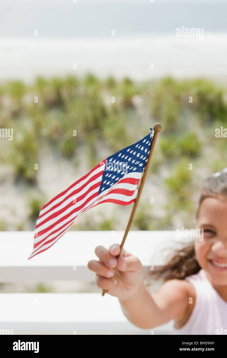 Hispanic girl holding American flag Stock Photo - Alamy