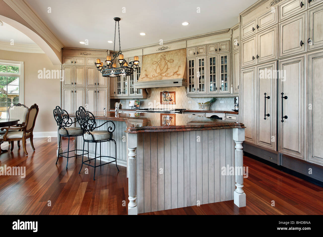 Kitchen In Luxury Home With Curved Island Stock Photo Alamy