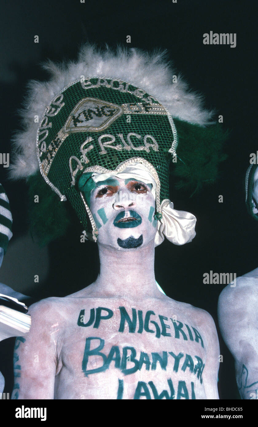 A  Nigerian fan with headwear 'SUPER EAGLES THE KING OF AFRICA'  at an Africa Cup of Nations football game, 2002. Stock Photo
