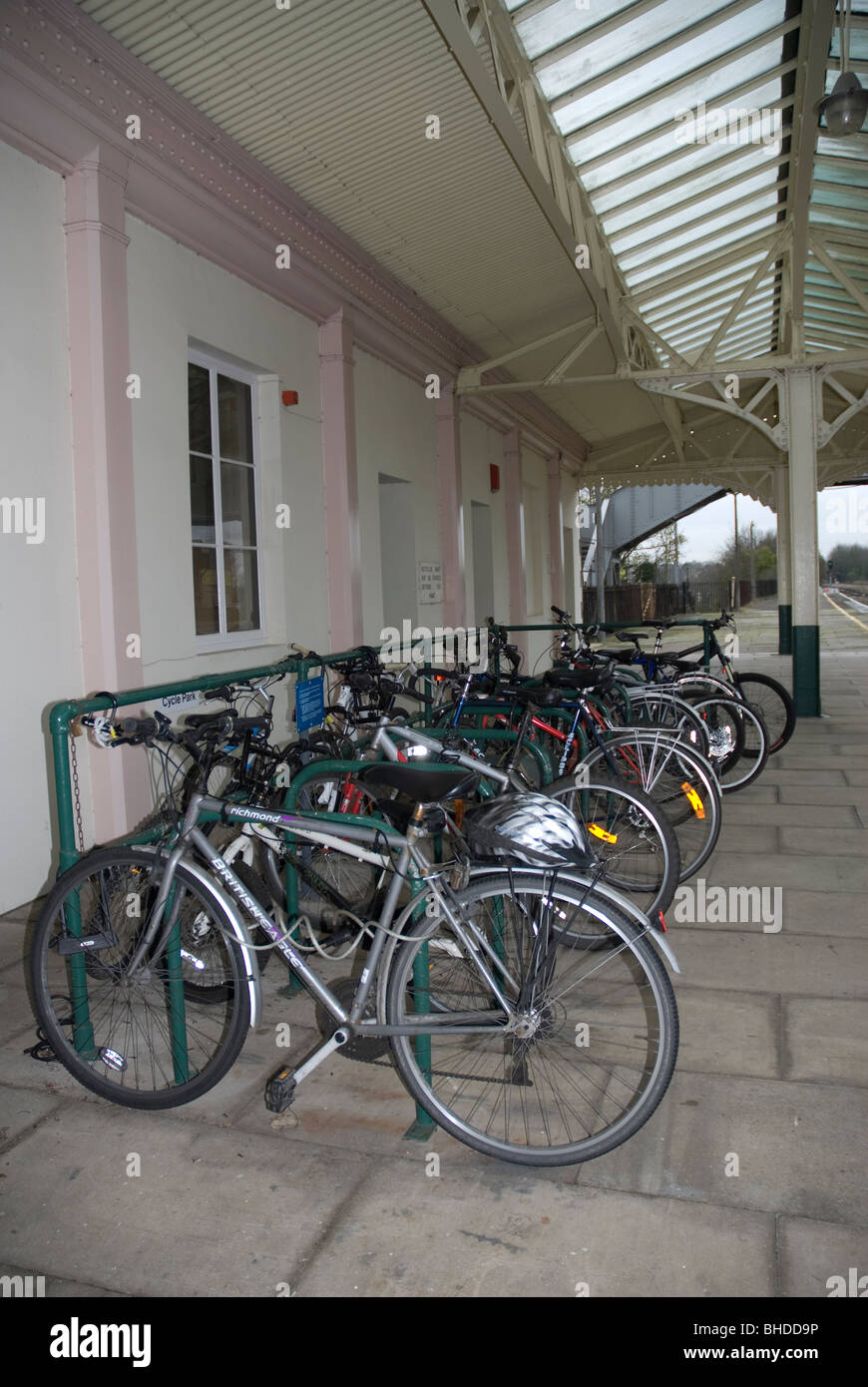 Bicycles chained to a cycle rack on the platform at Chippenham Railway