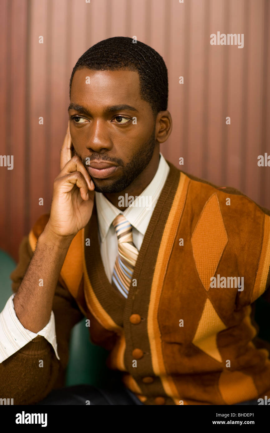 Well-dressed African man looking pensive Stock Photo