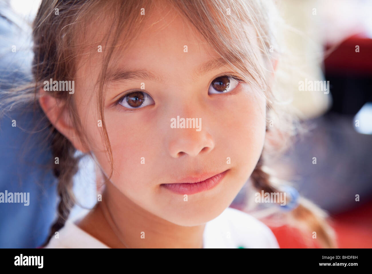 Serious mixed race girl Stock Photo Alamy