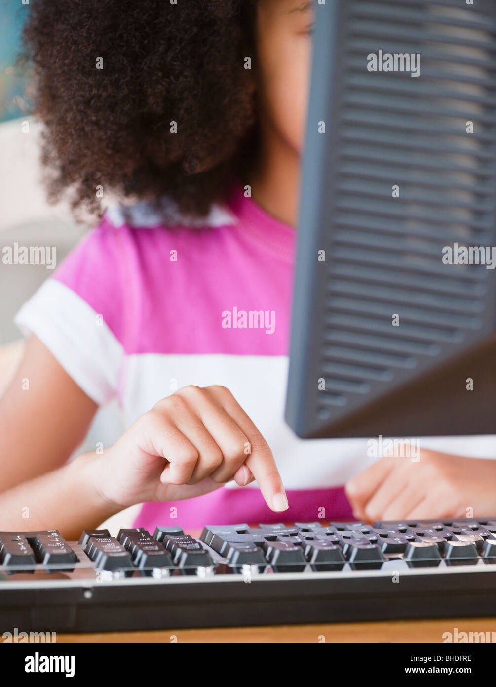 Hispanic girl using computer Stock Photo