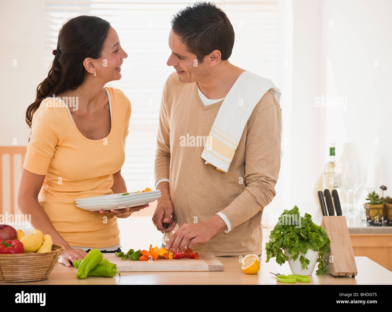 Hispanic couple cooking Stock Photo