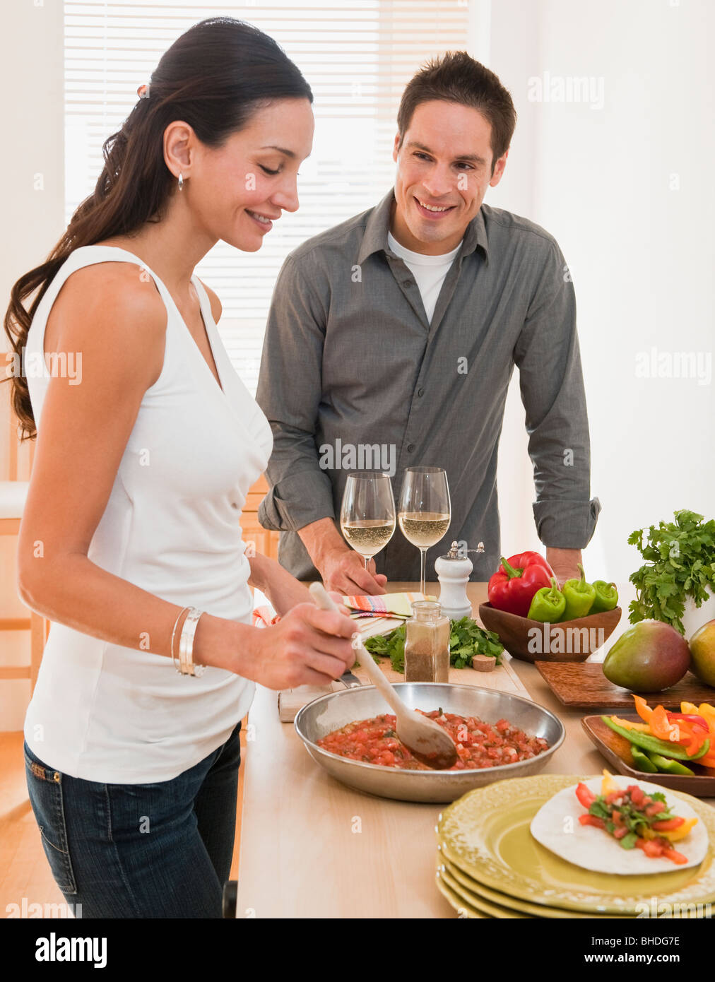 Hispanic couple cooking dinner Stock Photo