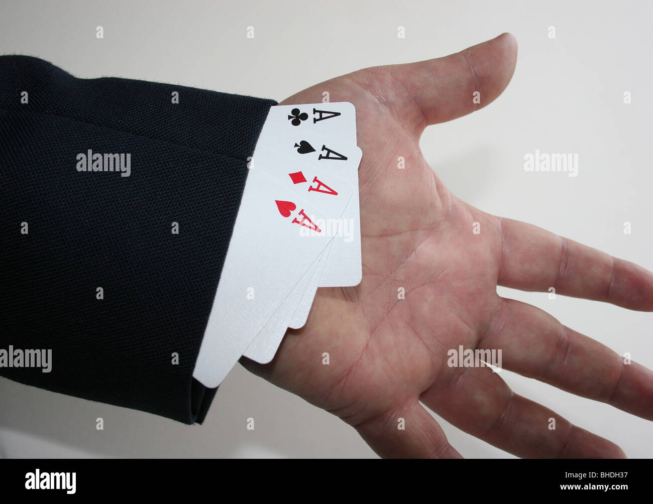 Magician with cards up sleeve Stock Photo Alamy