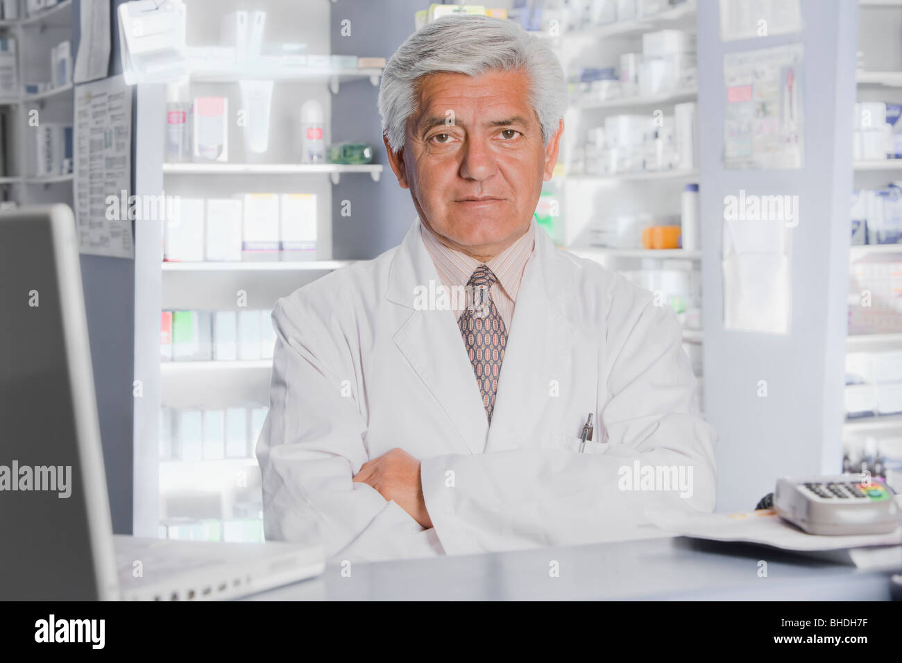 Hispanic pharmacist in drug store Stock Photo