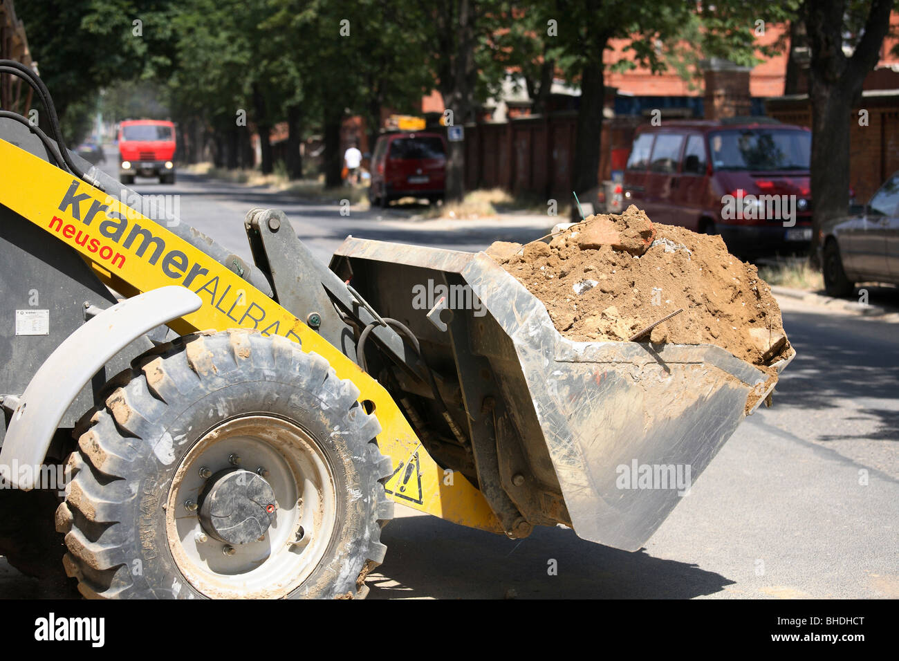 Bucket digger loaded with rubble Stock Photo Alamy