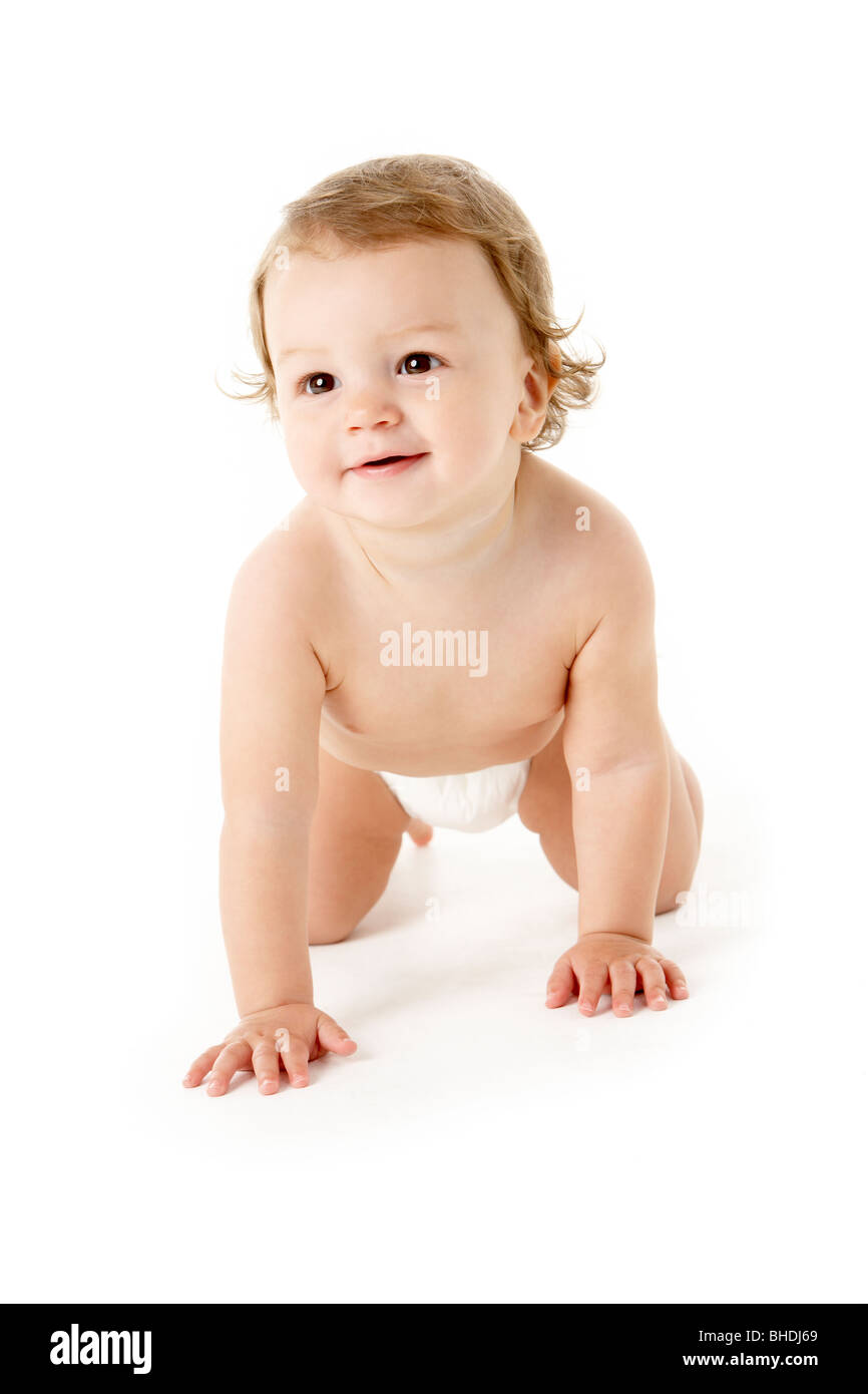 Studio Portrait Of Baby Boy Crawling Stock Photo