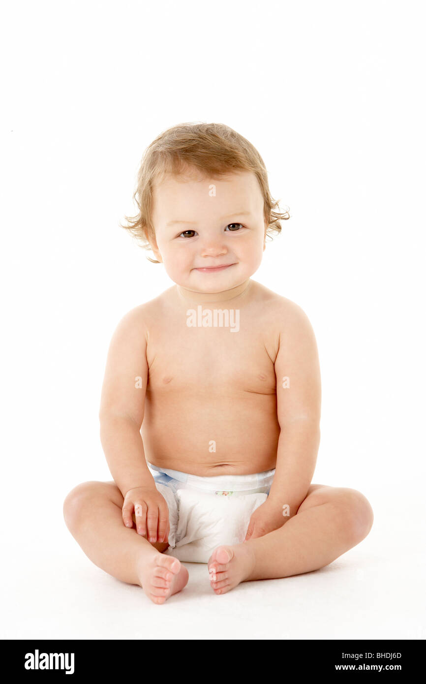 Studio Portrait Of Baby Boy Sitting Stock Photo