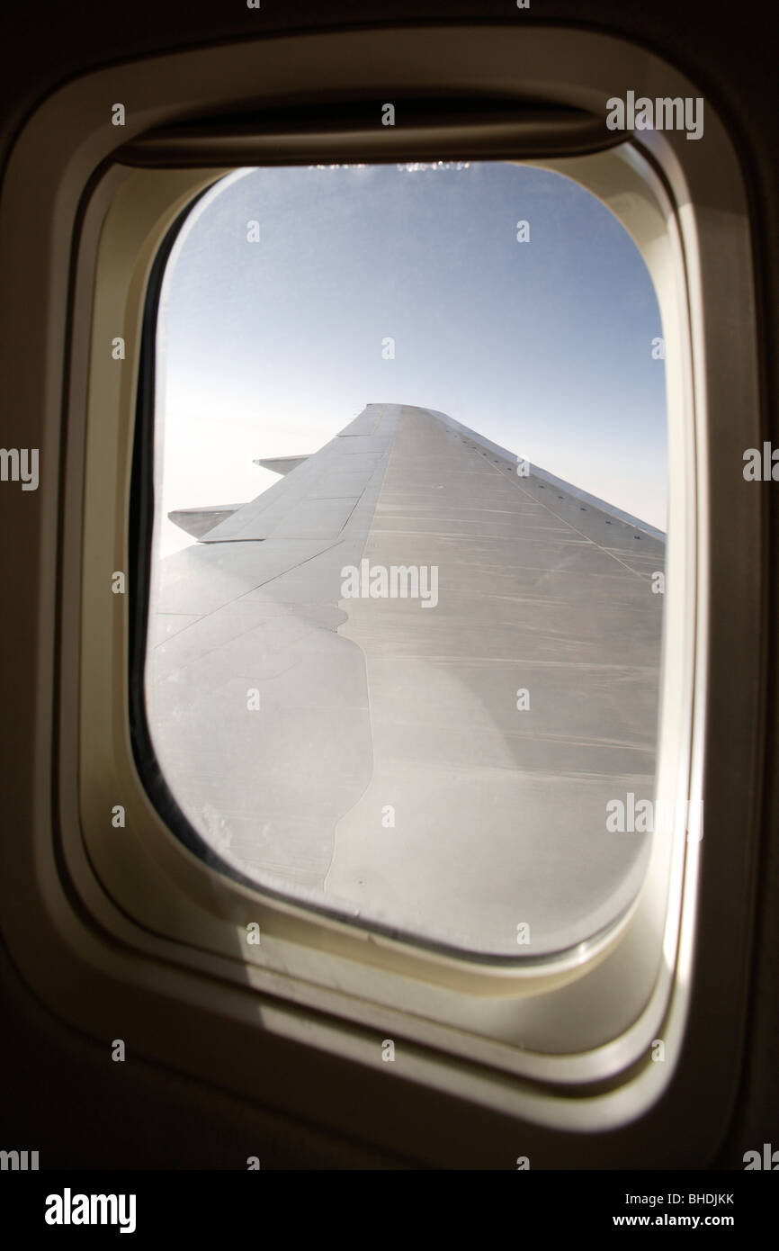 aircraft window with wing in view Stock Photo - Alamy