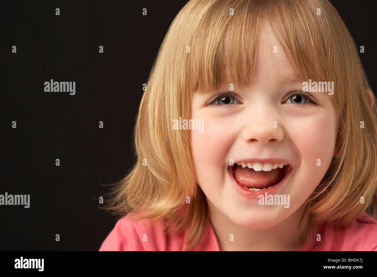 Close Up Studio Portrait Of Smiling Young Girl Stock Photo - Alamy