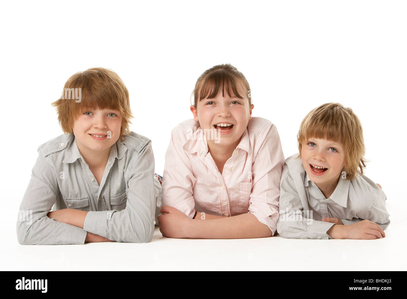 Studio Portrait Of Brothers And Sister Stock Photo