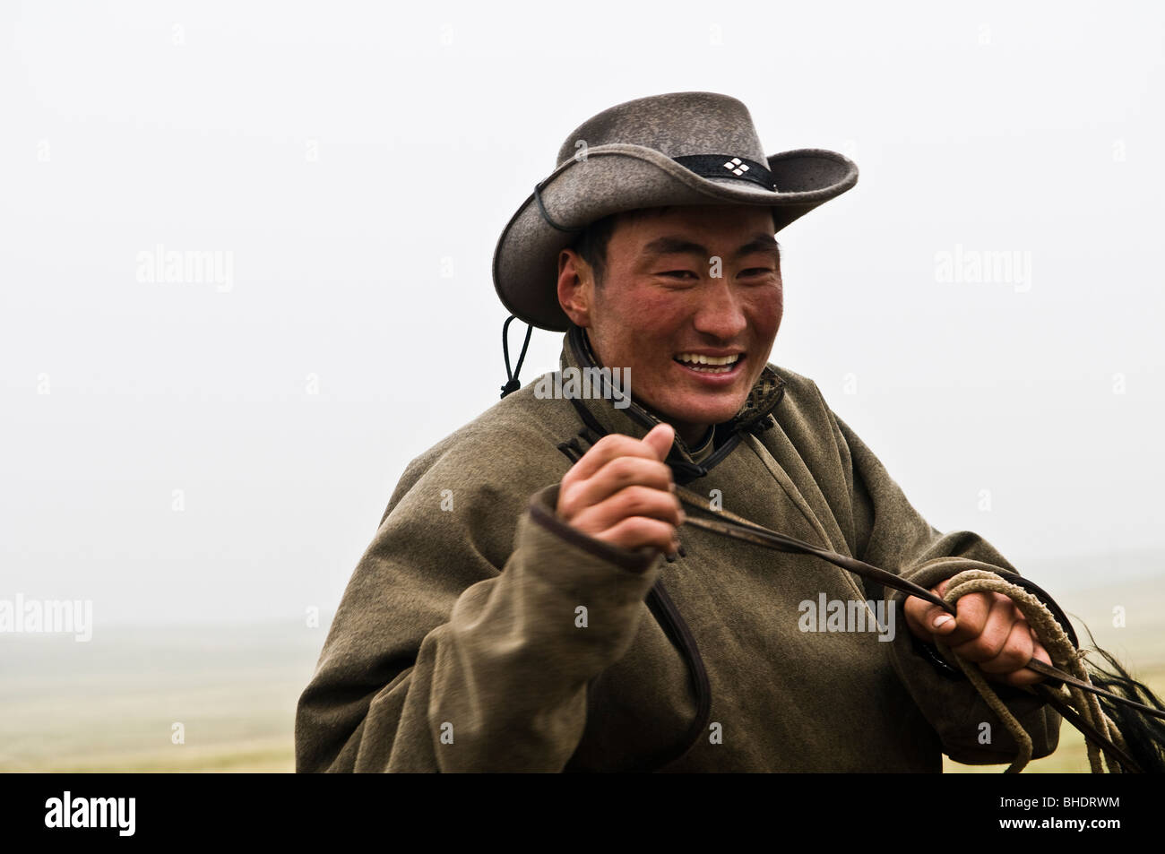 Portrait of a Mongolian herder in the vast Mongolian grasslands Stock ...