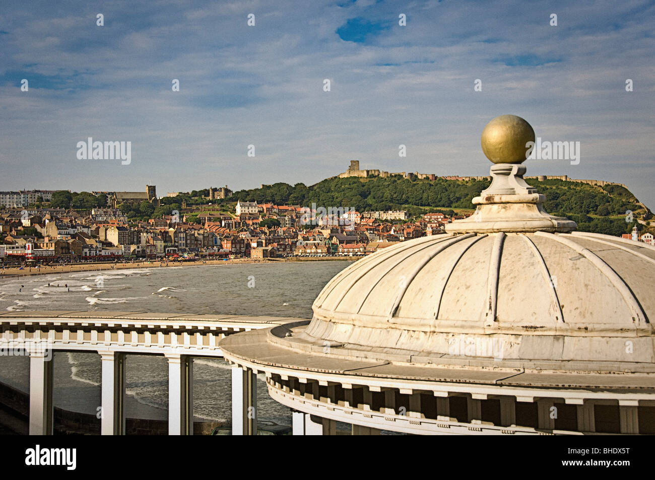 Ornate roof of the bandstand at The Spa with  Scarborough in the background Stock Photo