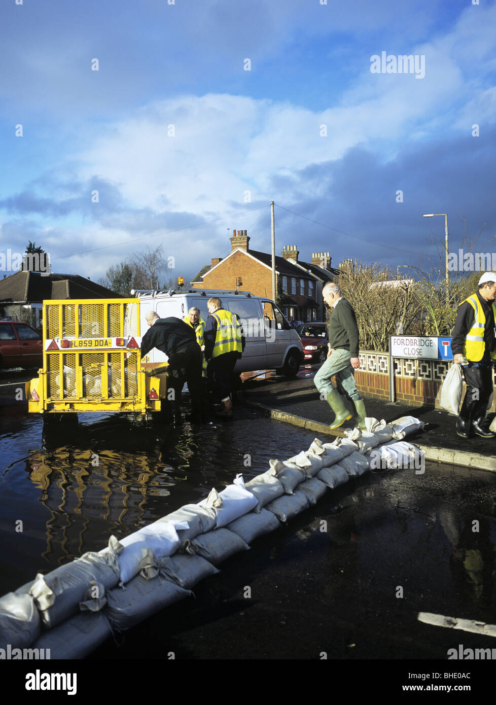 Delivery of sandbags for a flooded street. Chertsey, Surrey, England, UK, Britain. Stock Photo