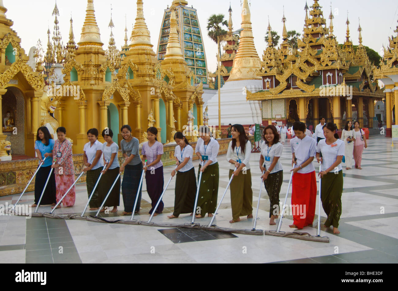 Sweeping ritual by young women on the main terrace, Shwedagon Pagoda