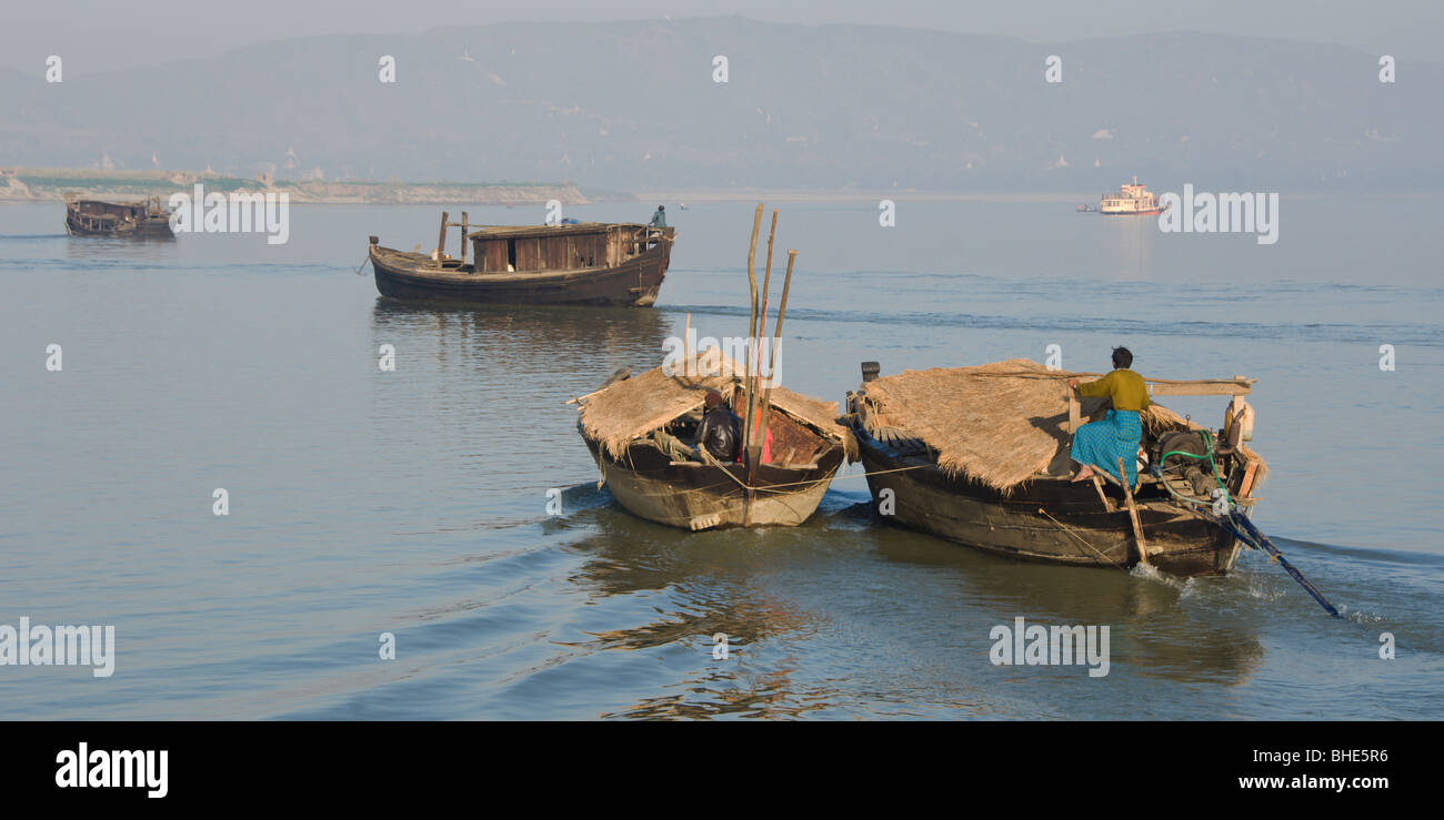 Small boats navigating on the Irrawaddy, Mandalay, Burma, Myanmar Stock Photo