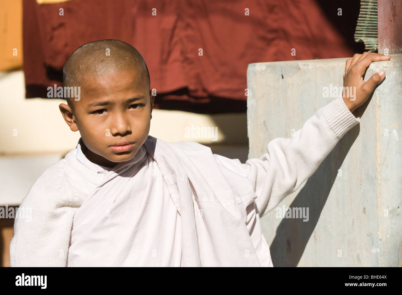 Young Buddhist monk, MahaGandhayon Kyaung monastery, Amarapura, Burma, Myanmar Stock Photo