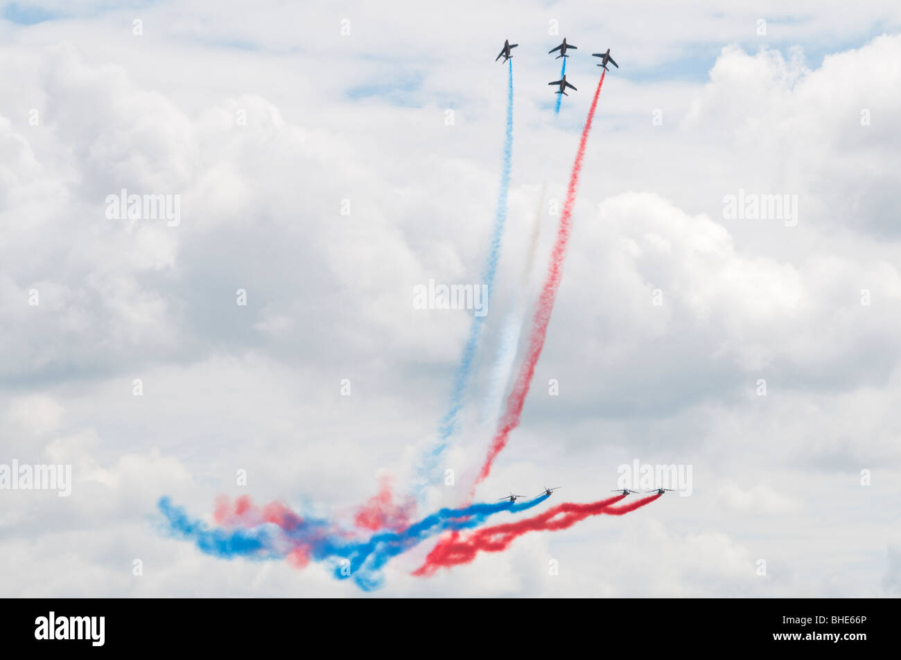 French Aerobatic display team flying in close formation trailing coloured smoke Stock Photo