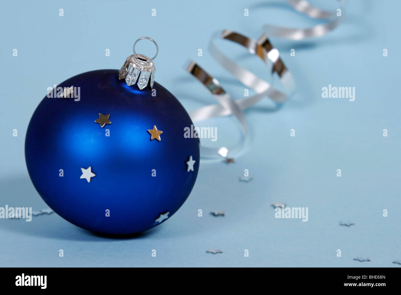 Blue Christmas ball on the blue background Stock Photo - Alamy