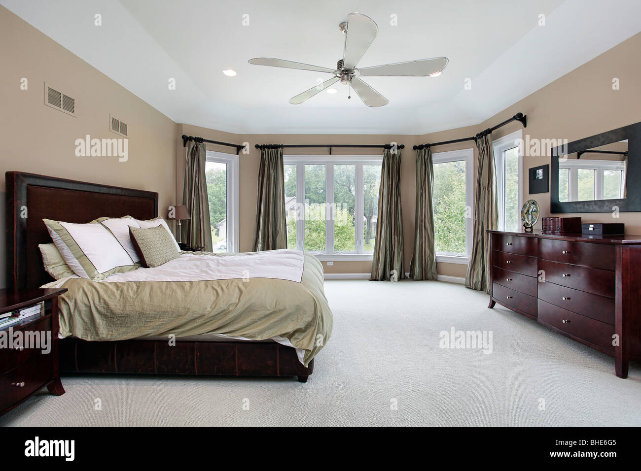Master bedroom in luxury home with wall of windows Stock Photo - Alamy, image size:1300x956
