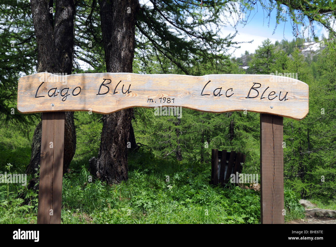 Sign board announcing Il Lago Blu or Lac Bleu at 1981 metres in Valtournenche Italy near the Matterhorn or Il Cervino Stock Photo