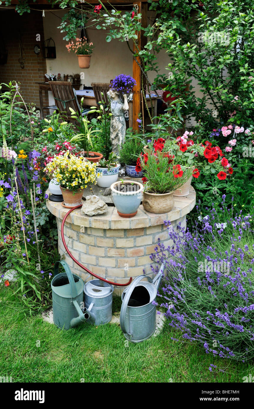 Fuchsia (Fuchsia), Nemesia, petunia (Petunia), lobelia (Lobelia) and lavender (Lavandula) in a backyard garden. Design: Jutta Wahren Stock Photo