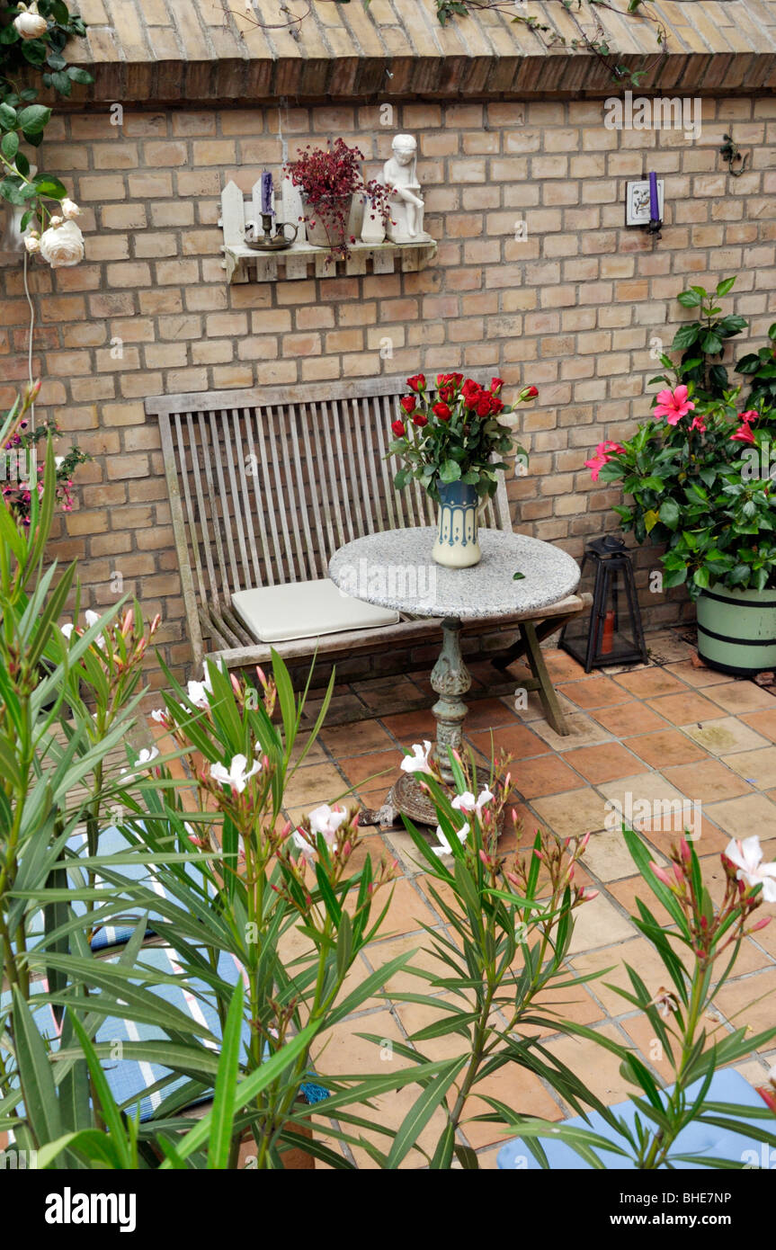 Terrace of a backyard garden with seating area. Design: Jutta Wahren Stock Photo
