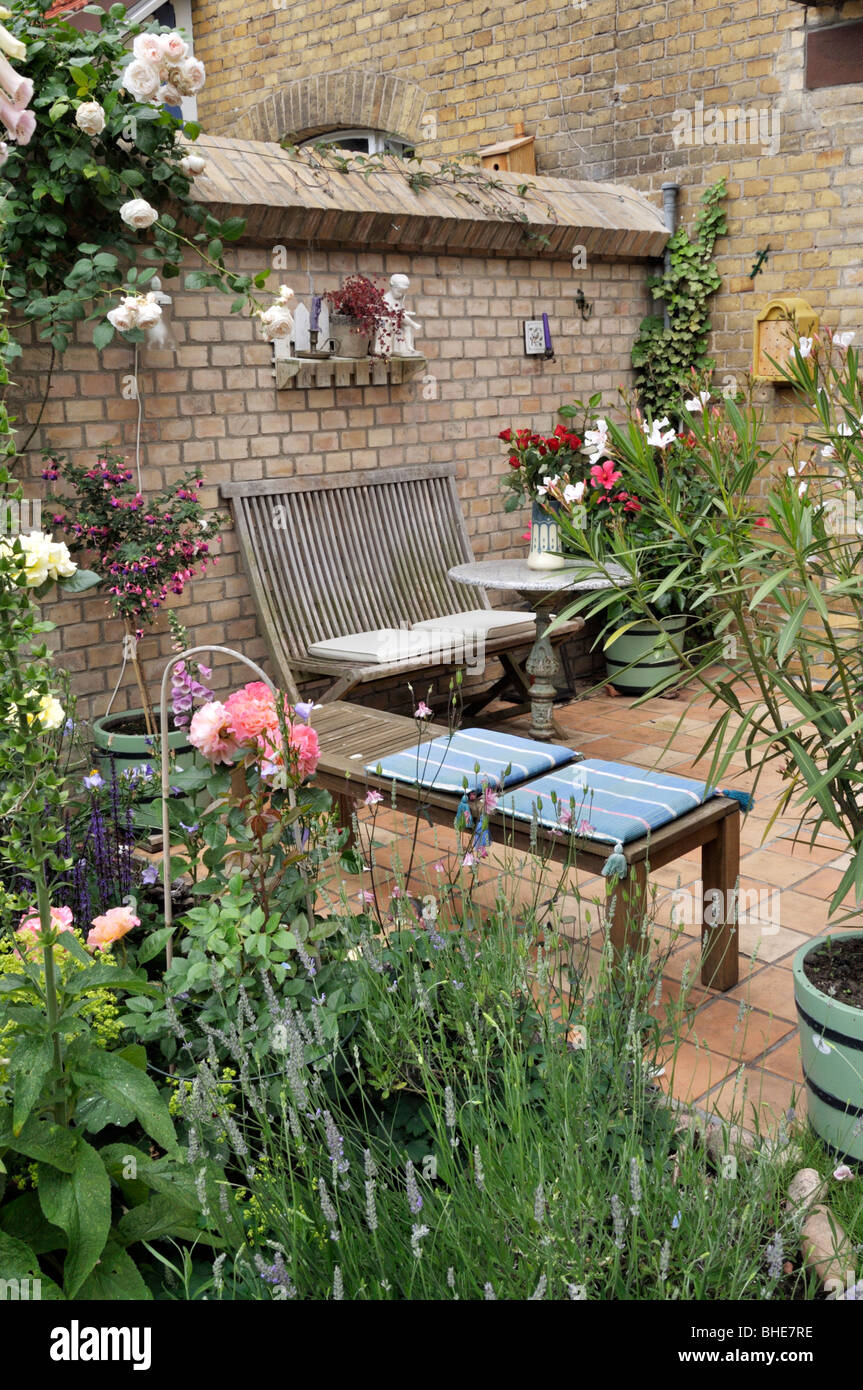Terrace of a backyard garden with seating area. Design: Jutta Wahren Stock Photo