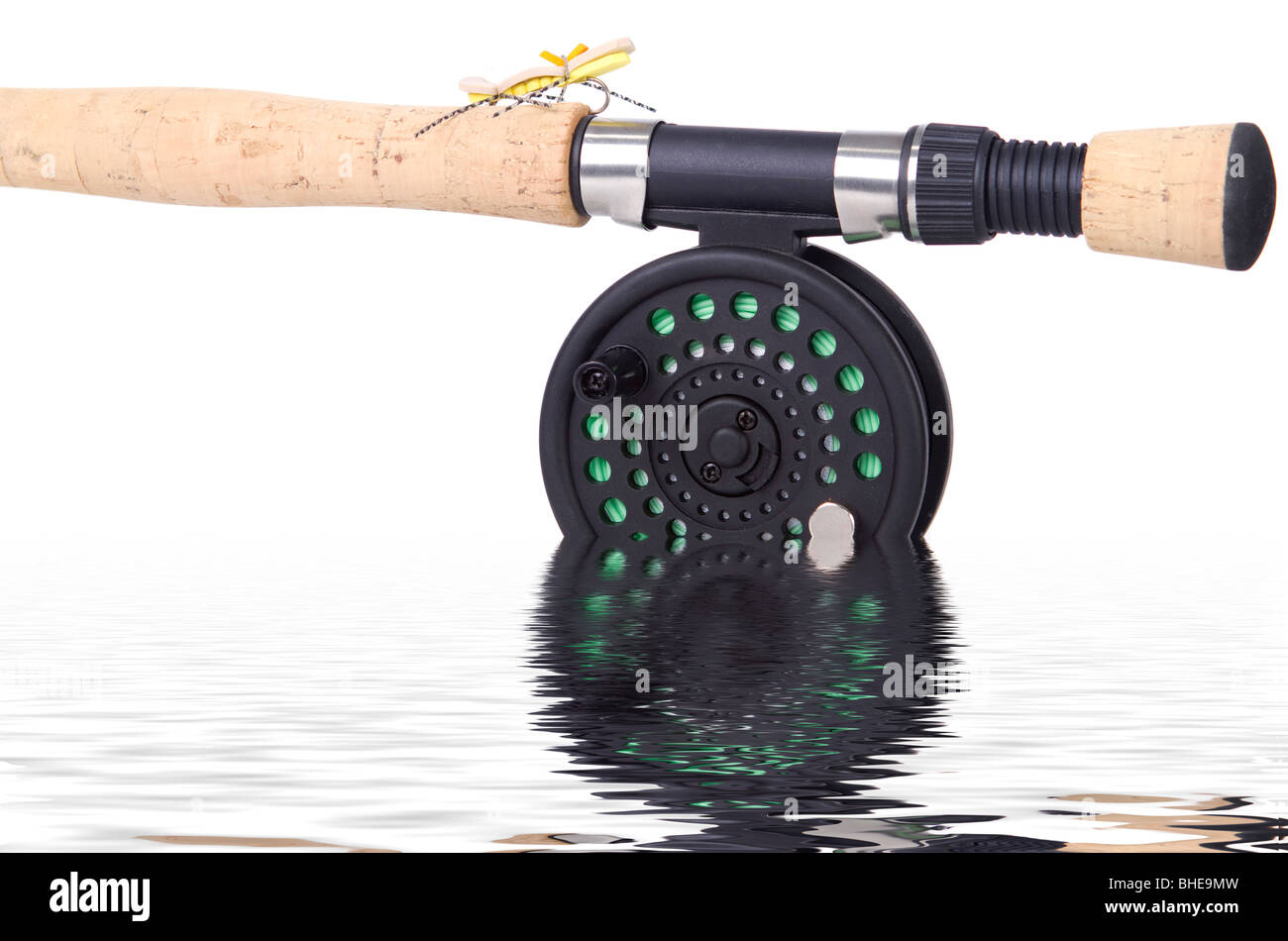 Fly rod and reel with fly isolated in the water Stock Photo Alamy