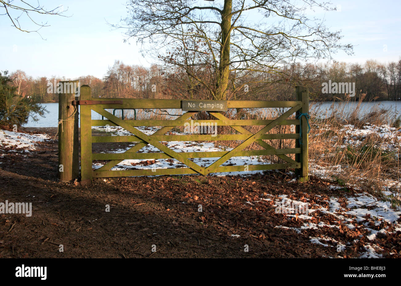 A five bar gate with a No Camping sign next to a public footpath by ...