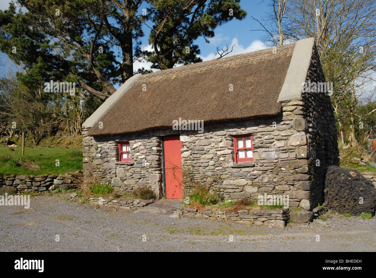 Traditional Irish stone cottage with a thatched roof in County Cork