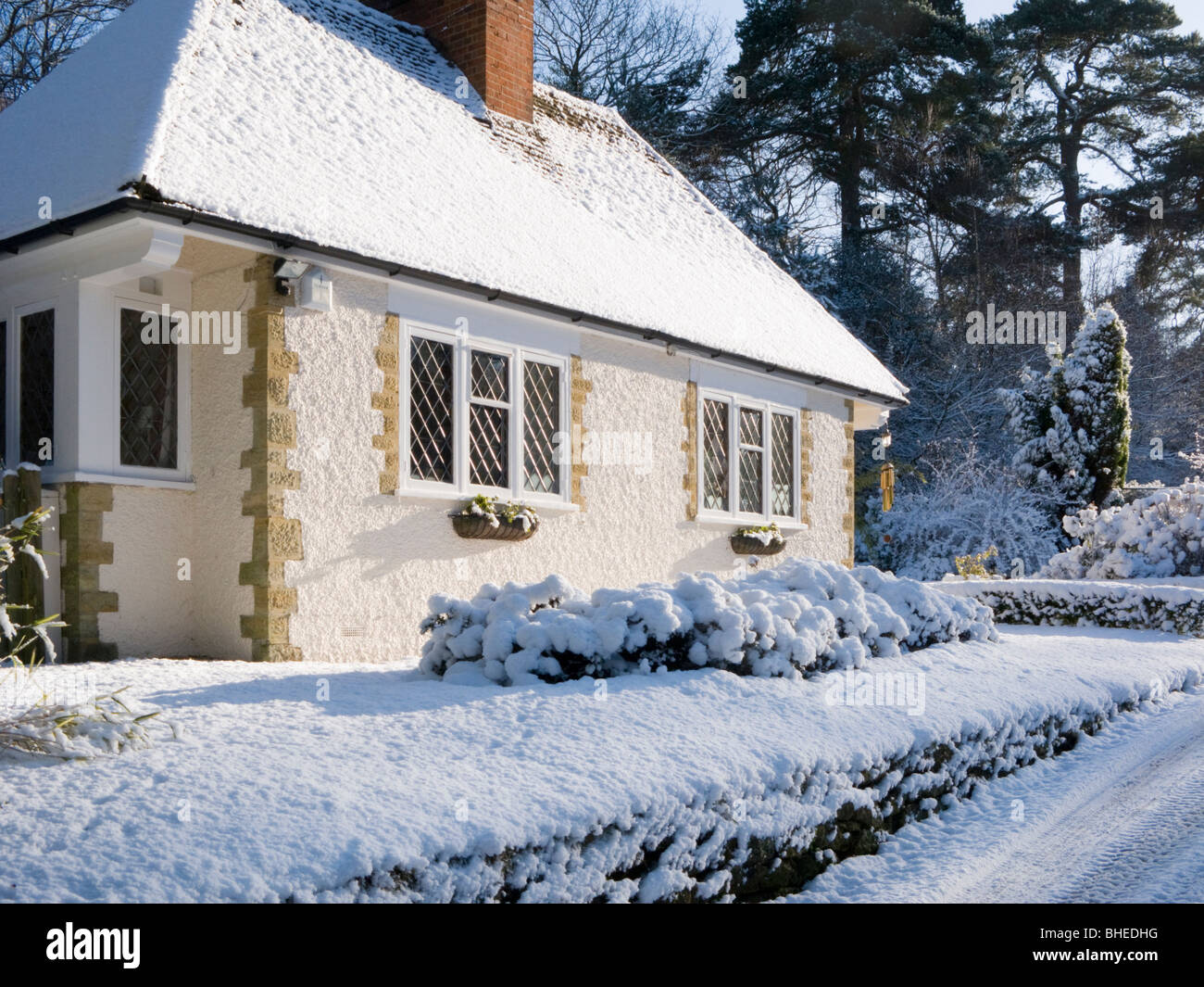 Cottage in snow, Peaslake, Surrey, UK Stock Photo