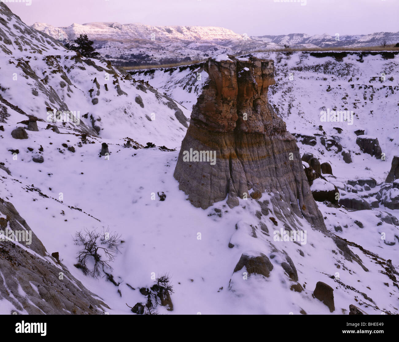 NORTH DAKOTA - Sunset over a snow-covered Theodore Roosevelt National Park. Stock Photo