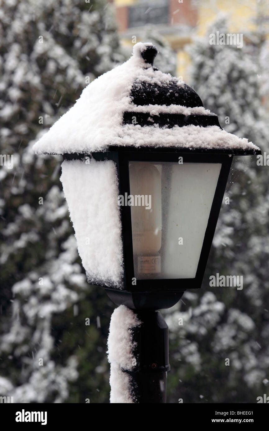 Lamppost covered in snow Stock Photo