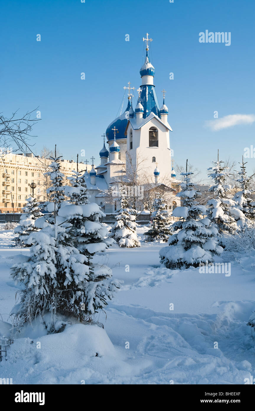 Russian Orthodox Church in St. Petersburg city under white snow. Winter